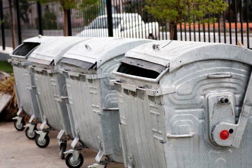 Recycling bins and sorted waste materials